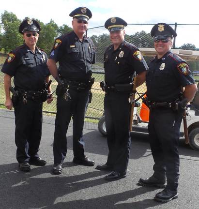 Goshen village police officers with Chief James Watt (second from right)