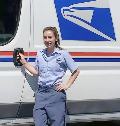 ‘I am so thankful to still be working during these trying times’ Mail carrier Shelby Conklin, who has a Whispering Hills route in Chester. Photo by Ginny Privitar.