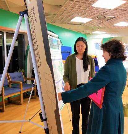 Tuxedo Town Board member Michele Lindsay talks with an Orange County staff member at the final Orange County 2045 Long Range Transportation Plan public workshop Nov. 6 at the South Orange Family YMCA.