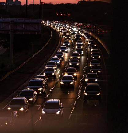 Photo illustration of highway traffic by Miguel Barrera via pexels.com.