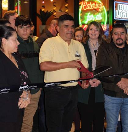 Carlos Cucina II owner Carlos Morales with Goshen Mayor Molly O’Donnell at the ribbon cutting ceremony Nov. 29. Photo provided.