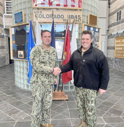 Orange County Executive Steven M. Neuhaus (left) and Navy Operational Support Center Commanding Officer Captain James MacDonald.