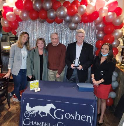 Goshen Ecumenical Food Pantry Board Members Jennifer Ellis Anderson, Susan Armistead, CEO John Strobl and President Mark O’Hara accepting the award from Goshen Chamber Executive Director Erin Roslund.