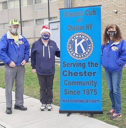 Pictured from left to right: Ed Stoddard, Frank Sambets and Colleen Collins get ready to hand out the gifts.