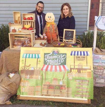 Rabbi Meir and Rivkie Borenstein of Chabad of Orange County at the Rosh Hashanah farmers market in Goshen on the morning of Rosh Hashanah.