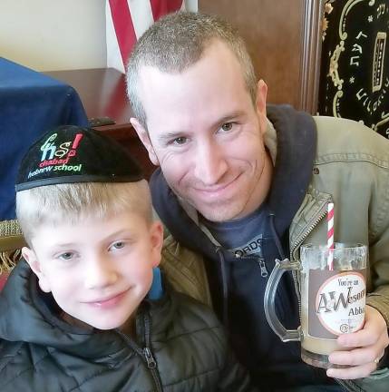 Cory Benezra of Monroe and his dad Eric at A&amp;Wesome Aba Father’s Day event at Chabad Hebrew School.