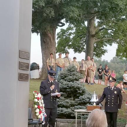 Ed Stoddard, organizer of the 9/11 memorial event, and Fireman Joe McCourt read the names of the deceased Chester residents