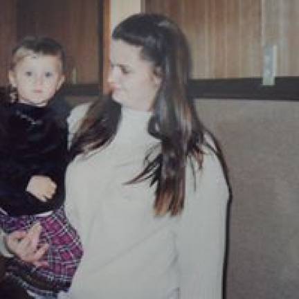 Mommy & Me Contest Brandi Kerr of Polk, Pa. holding Erica at a family Christmas party.