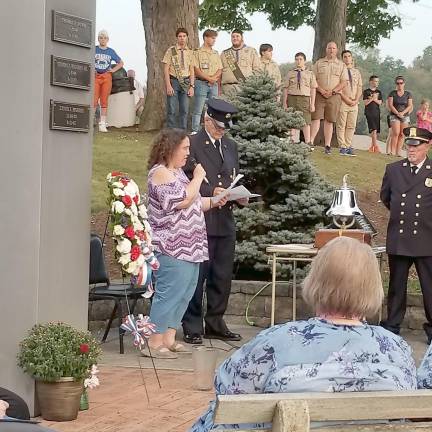 Jeanmarie Tuzio, daughter of Donald Tuzio, lost on September 11, 2001, reads a poem.