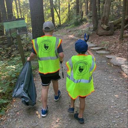 Carlozzi boys Matt and Maximilian cleaning up trash at The Delaware Water Gap.