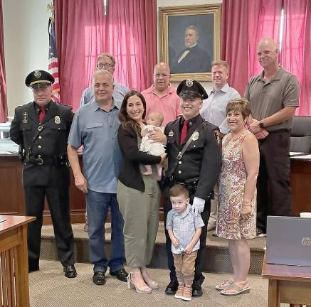 Detective Robert A. Kozlowski is joined by his family.