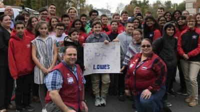 Members of Goshen Science Olympiad senior and junior teams gather 'round Lowe's managers Paul and Victoria to say thank you for delivering $2,500 in merchandise.