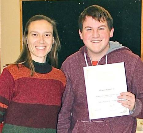 High school students honored as 'Goshen Greats' Michael Kensell Jr. with music teacher Kim Longo