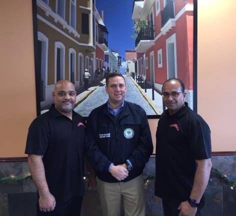 Dos Latinos Restaurant is 'open for business' Orange County Executive Steven M. Neuhaus, center, meets with Dos Latinos Restaurant owners Rommel Cartright, left, and Edgar Perez on Monday, Dec. 5.