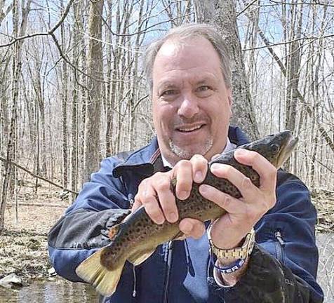 DA Hoovler helping the Orange County Federation of Sportsmen to stock trout