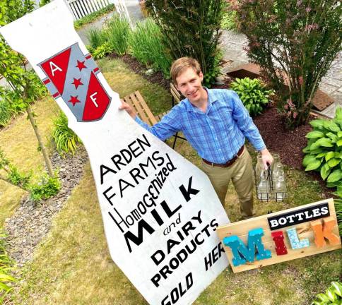 Alex Prizgintas stands next to one of the Orange County Milk Bottle Museum’s prized artifacts. This sign, painstakingly recreated from an original in private hands, once graced the milk bar of the Arden Farms Dairy Company located on Route 17 south of the village of Harriman.