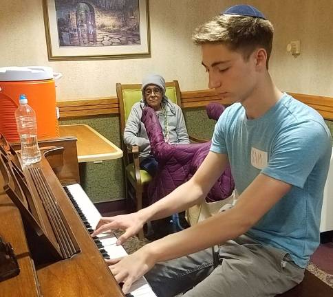 Chabad’s CTeen Cares Program spreads community kindness CTeen Cares participant Samuel Koyfman of Chester plays piano at Sapphire Adult home in Goshen (Photo provided)
