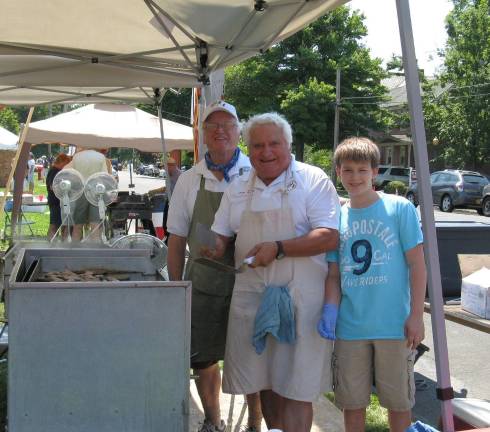 Scenes from Great American Weekend From left: Luca Spensieri, Al Barante, and his grandson Jason Ferrante of the Central Orange County Italian-American Association make the best sausage and peppers in the OC.
