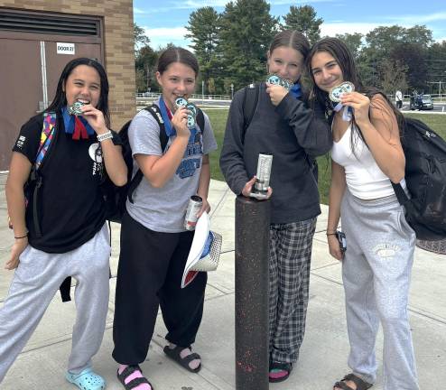 Swim team shines at Eastern Invitational From left: Goshen Swim and Dive team members Rhyanne Ruffy, Alexis Sofia, Grace Matthews and Aimee Mancuso.