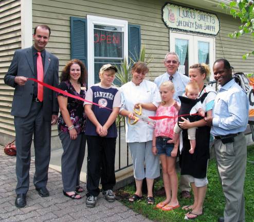 How sweet it is Lauras Sweets celebrates its grand opening in Sugar Loaf Photo by Roger Gavan On Aug. 8, members of the Warwick Valley Chamber of Commerce joined owner Laura Vreeland and her sister Maria Malara for the grand opening of their retail boutique bakery. From left, Warwick Valley Chamber of Commerce Board members Paul Rafanello and Susan Ronga, Lauraís Sweets Specialty Bake Shoppe owner Laura Vreeland and her children: Timmy, 10, and Alayana, 12, Chamber Executive Director Michael Johndrow, Maria Malara with her daughter Zoe, 7 months, and Cedric Glasper, president of the Warwick Valley Chamber of Commerce.