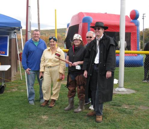 Chester celebrates the haunting season Alex Jamieson, Kaitlin O'Brien as Ghostbuster mom; Gretchen Leitner as fisherwoman; Walt Popailo; and Tony Pegg as undertaker or cowboy, depending on viewer (Photo by Ginny Privitar)