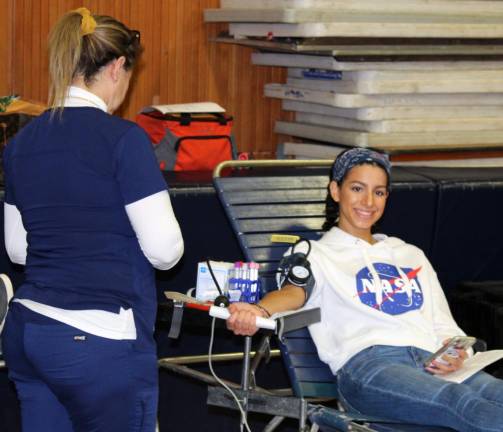 Burke Catholic senior Miranda Renelt giving blood