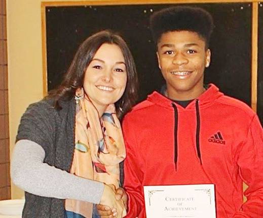 High school students honored as 'Goshen Greats' Anthony Gorham with business teacher Danielle Dziedzic