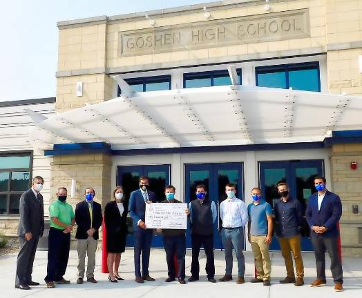 Goshen School District awarded $50,000 grant to establish emerging cybersecurity, aviation and drone flight lab Assemblyman Colin Schmitt holding check in center with Goshen School Superintendent Daniel Connor and from left to right Orange County Legislator James O’Donnell, Assistant Superintendent of Curriculum and Instruction Jason Carter, Goshen High School Assistant Principal Kyle Roddey, Goshen High School Principal Jennifer Martin, Goshen School Board President Jason Pucci, Computer Science Teacher Dillon Johnson, Technology Teacher Joseph Fedor, Technology Coordinator Jonathan Redeker and Assistant Principal and Director of Athletics Dr. Matthew O’Brien. Provided photo.