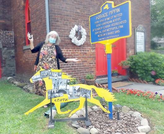 Jacqueline O’Malley-Satz and her Painted Trotter at St. John’s African Union Methodist Church, the former home of the Black artist Horace Pippin.