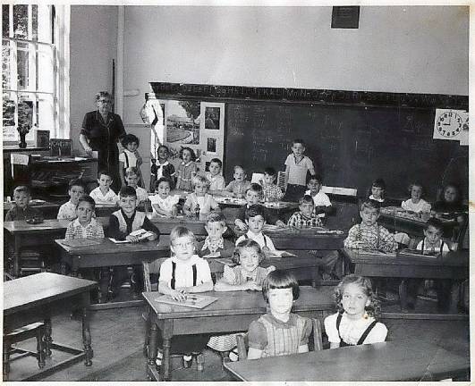 Mrs. Roe's first grade, 1955-56: Kathy Laroe, Charlotte (?), Wilma Kirkland, Kathie Ruback, Terry House, Bobby Boyle, (?), Bob Buchalski, Rich Vadala, John Burrows, Fred Cardillo, Ruth Ann Garvilla, Anagret Hoffs, Karen Jensen-Tush, Bob Clegg, Gary Faber, Tom Richner, (?), Bob Kolk, Joyce Musumeci, Brenda Custard, Kathe Green, Howie Smith, Gus Kelder, Bill Demrest, (?), Joe Cosco, Melissa Chamberlain, Judy Mapes, Chris Deitrick