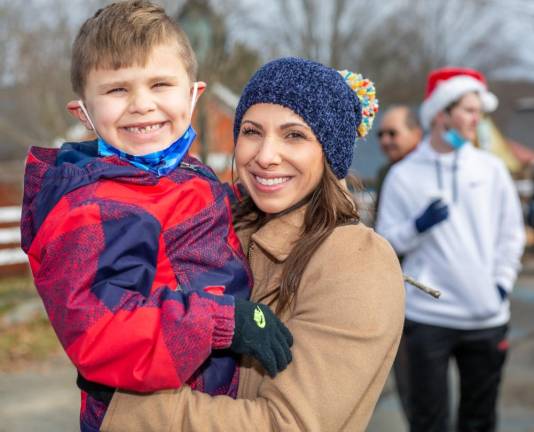 Sharlene and Juan Goris were smiling ear to ear as Santa landed.