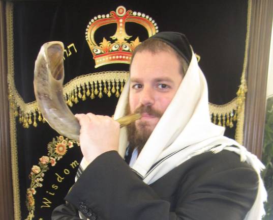 All are welcome at High Holiday Services and children’s programs at Chabad Photos courtesy of Chabad of Orange CountyRabbi Pesach Shofar, director of Chabad of Orange County, show here blowing the shofar, will lead community High Holiday Services to the community, free of charge, at the American Legion Banquet Hall in Monroe.