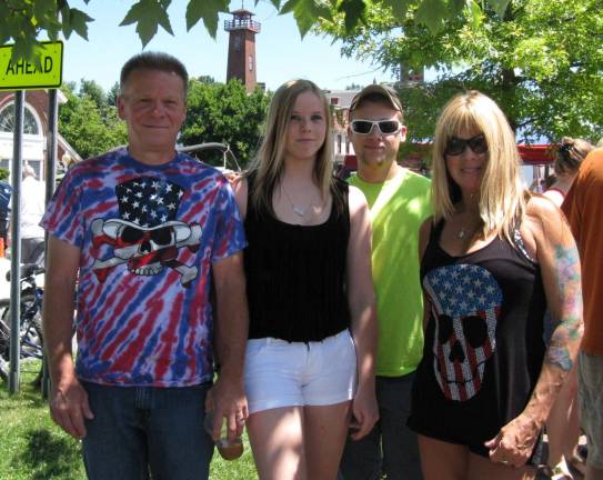 Great American Weekend brings on the crowds Bill Redner (far left), wife Dee (far right), daughter Corinne, and Jayme Uberto, all of Pine Bush, are in the holiday spirit.