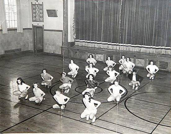 Seventh-grade gym class, 1945-46: from left, starting in the back row: Helen Lupinski, Joan Green, Ruth Utter, Jean VanDuser, Julia Price, Sue Holstein, Marian Lippert, Cenevieve Dolson (Dalton), Ella McGinnis (Dolson), Mable McGinnis, Barbara “Toot” Cathy (Spina), Valerie Roach, Sally Johnson, Wilma Van Malden, Marian Hosklin (Lewis), Edna O’Connell