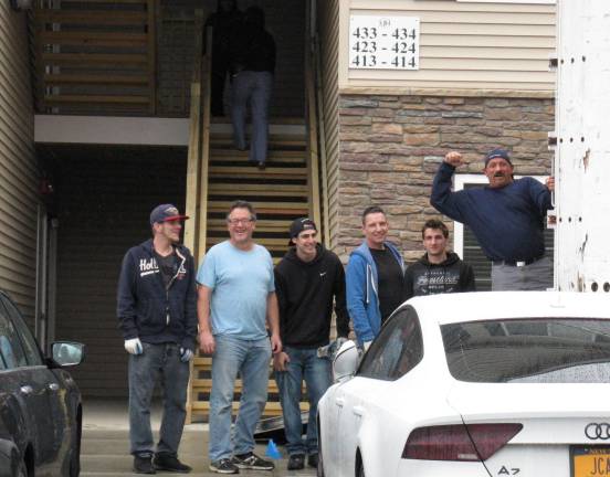 New beginnings at Meadow Hills Humor makes the job easier: Steve Bollenback and Tony Corradino's crew on moving day (Photo by Ginny Privitar)
