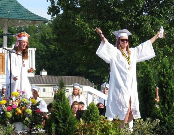 Goshen's Class of 2014 Camille Bowen salutes the crowd.