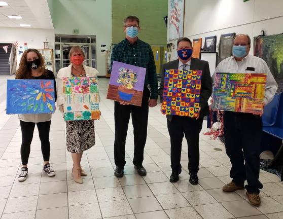 Chester Board of Education members were recently presented with artwork created by CES students. Pictured from left to right are: Dawn Guevara, Vice President Sandy Nagler, Keith Brideweser, President Frank Sambets and John Pasichnyk. Photos provided by the Chester School District.