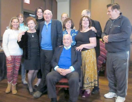 Lou Covello with some of his family, daughters JoAnn (black dress), Barbara (blue and white), and Victoria (gold skirt)