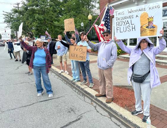 Hundreds rally in ‘No Kings Day’ protest Protesters lined both sides of the street in Goshen.