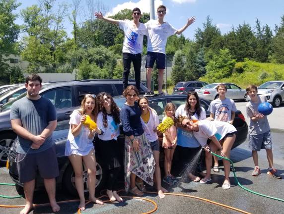 Chabad’s CTeen Cares Program spreads community kindness CTeen Cares spearheaded a Charity Car wash to benefit pediatric cancer patients as part of their community service week (Photo provided)