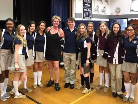'I’m living proof of what happens to people who make poor choices' Sarah Panzau Evans with Burke Catholic High School students (Photo provided)