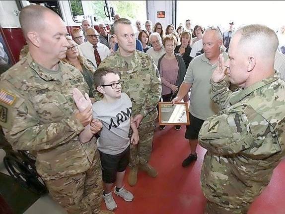 Danny Mulvey used the phrase “Faith, Family and Friends” for his challenge coin after his induction in the U.S. Army as an Honorary Solider, one month before his passing. Provided photo.