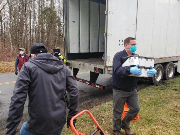 Orange County Executive Steve Neuhaus delivers nonperishable foods