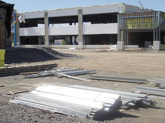 This 17,200-square-feet two-story building to house the Garnet medical facility, located to the left of the entry into Goshen Plaza.