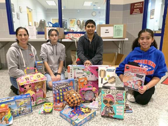 L-R: Club advisor Diane Villegas, Lucy Davila, Ishaan Bagam, and Tatiana Douet.