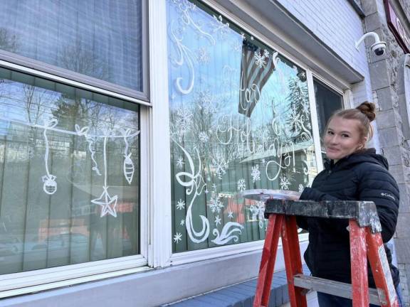 Chester Academy students decorate local shops with holiday scenes