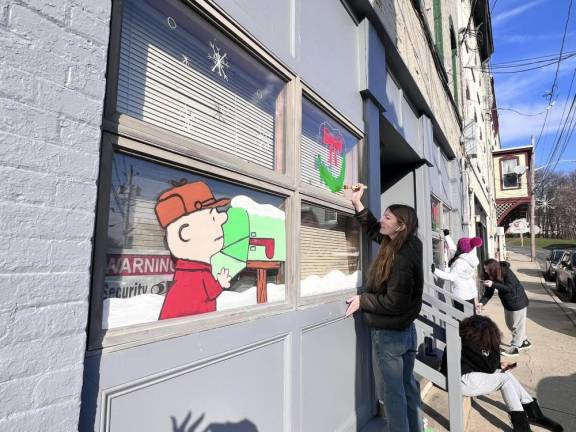 Chester Academy students decorate local shops with holiday scenes