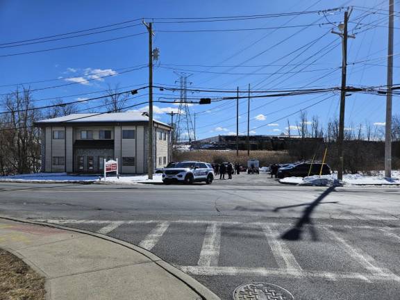 The Sheriff’s Office set up a staging area at a dental office down the road from the apartment complex.