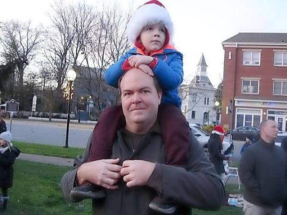 Five-year-old Matthew Shade watched and listened to his sister, Olivia,