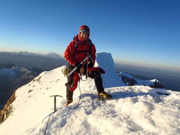 John Trentini takes flight, in medicine and in life John Trentini at the summit of Huyana Potosi in Bolivia, elevation 19,974 feet (Photo provided)